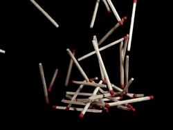 Matches falling against Black background, Slow motion Stock Footage