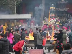 MS Shot of People burning incense in temple during chinese new year / Xi'an, Shaanxi, China Stock Footage