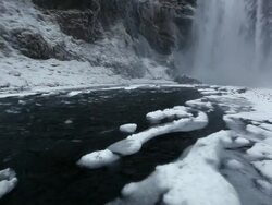 MS Shot of Water and icy snow coming down river at snowing condition / Iceland  Stock Footage