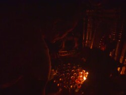 MS Worshippers pouring  liquid into candle holders and lighting them in  temple  / Kathmandu, Central, Nepal Stock Footage