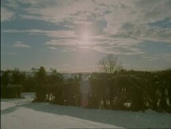 WA cotswold countryside in snow, sun and lens flare, Cotswolds, England Stock Footage