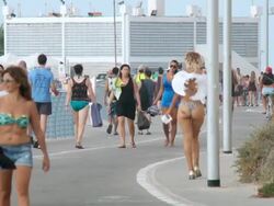 WS Shot of transvestite looking woman with angel wings walking on promenade / Tel Aviv, Dan Metropolitan,Gush Dan, Israel Stock Footage