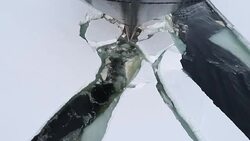 Ship hull breaking through ice in Antarctica, viewed from the ship bow Stock Footage