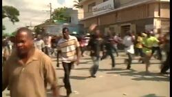 Haiti / Dominican Republic - Anti-government protest turns violent; police fire tear gas, protesters throw stones / Dominican authorities expel 244 Haitians after 3 people killed along Haiti-Dominican Republic border / Boat carrying Haitian migrants sinks killing more than a dozen people  / Protest against ruling that could strip citizenship from people of Haitian descent living in Dom Rep News Clip