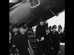 CAN 021 THE BEATLES RETURN TO LONDON TO WAITING THRONG OF FANS News Clip
