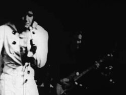 Elvis Presley sings before a live audience in Las Vegas Stock Footage