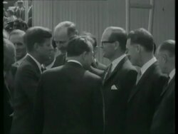 June 23, 1963 FILM MONTAGE WS Photographers/ Plane taxiing/ Soldiers/ MS John F. Kennedy greeting dignitaries/ MS Chancellor Konrad Adenauer speaking/  Stock Footage
