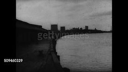 1937: COTTON NO LONGER KING: LS ARCHED Empty wooden port dock. Empty industrial area, building w/ 'No Admittance' sign. LS Empty railroad track between neglected warehouses, some new, white cotton lying on tracks.  Great Depression. Instructional Video