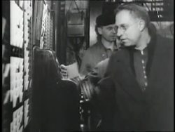 Employees punch the time clock. News Clip