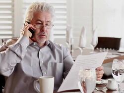 MS Business man talking on phone at restaurant / Santa Fe, New Mexico, United States Stock Footage