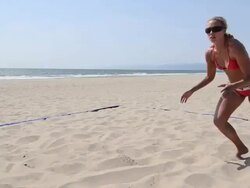 DS WS TS A female beach volleyball player diving for the ball. Stock Footage