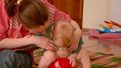baby sitting on a children's pot Stock Footage
