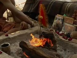 MS ZO Sadhu worshiping near river  / Pushkar, Rajasthan, India Stock Footage