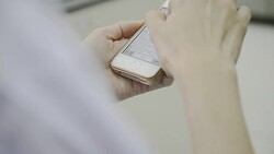 medical technician playing social network Stock Footage