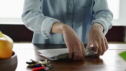 Woman looking through mail Stock Footage