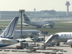 WS Shot of moving plane on runway and loading in parked plane / Frankfurt, Hesse, Germany   Stock Footage