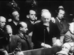 B/W 1946 senior man saying plea into microphone at war crimes trial / Nuremberg / newsreel Stock Footage