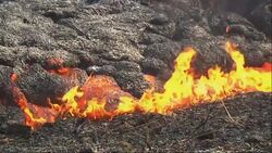 A lava flow that threatens the small town of Pahoa near the Kilauea volcano continues to stall at its front edge, with molten rock oozing out of the sides of the lava flow. News Clip