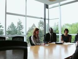 WS PAN coworkers in discussion in conference room/Seattle, Washington, USA Stock Footage