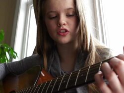 Beautiful teenager playing guitar Stock Footage