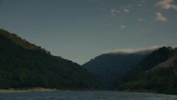 Clouds drift over a mountain lake. Stock Footage