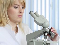 Female scientist with microscope Stock Footage
