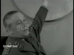 1949: SWEDEN DEFENSE COUNCIL: (POV through gates) War Department building, Stockholm. INT MS Swedish Commander-in-Chief General Helge Jung (1886-1978) at desk talking. WS Chief of Staff in meeting. VS Members talking (Navy & Air Corps Chiefs). Instructional Video