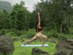 Young woman practicing yoga in the forest, Malshej Ghat, Maharashtra, India Stock Footage
