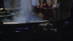 A street vendor prepares and cooks food in India. Stock Footage