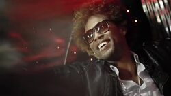 Hip-hop star in limousine gives peace signs to fans and paparazzi at awards show Stock Footage