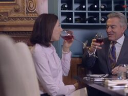 MS Business people talking in restaurant, waiter serving wine Stock Footage