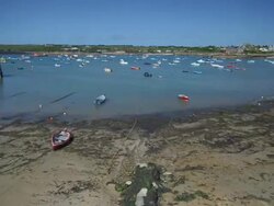 T/L tide coming in past moored boats, Scilly Isles, Cornwall, United Kingdom Stock Footage