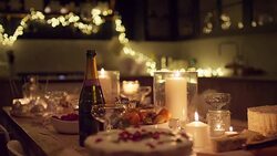 Champagne and Christmas desserts on candlelight table Stock Footage