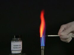 A flame test used in chemistry to detect the presence of certain metal ions, based on each elements characteristic emission spectrum (Sodium Nitrate) Stock Footage