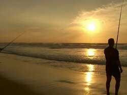 WS View of Silhouetted fishermen on beach at sunset, St Lucia / Kwazulu-Natal, South Africa Stock Footage