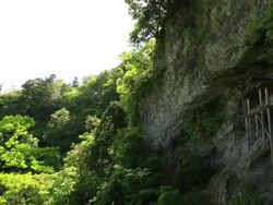 WS PAN View of wooden temple at rocky mountain cliff / Mount Mitoku, Tottori Prefecture, Japan  Stock Footage