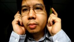 Asian man listen music with headphone Stock Footage