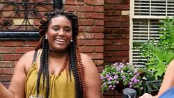 MS Woman in discussion with friends at outdoor table Stock Footage