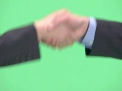 CU, Businesswoman and businessman shaking hands in studio, close-up of hands Stock Footage