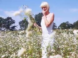 HD DOLLY: Young Woman Gathering Flowers Stock Footage