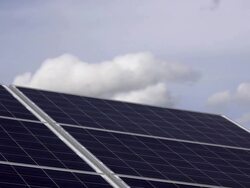 HD Solar Park Against Cloudy Sky Time Lapse Stock Footage