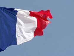 CU SLO MO Shot of French flag waving in Wind / Caen, Normandy, France Stock Footage
