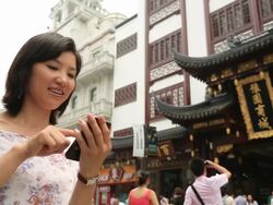 Young women using smartphone in Yuyuan Tourist Mart Stock Footage