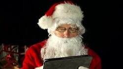 Father Christmas, Santa Claus in sleigh on Tablet, close Stock Footage