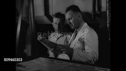 1938: PARIS, FRANCE: Russian Cyrillic lettering on building. INT Printing Room w/ two men looking over, discussing paper. Printing press rolling paper page. EXT Same building, different angle, traffic FG. Taxi driver standing by car reading newspaper. Instructional Video