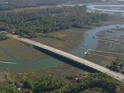 WS AERIAL View of bridge over Savannah River estuary and jetty / Georgia, United States Stock Footage