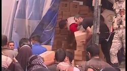 Aid Boxes Unloaded in Qayyara News Clip