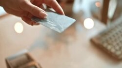 SLO MO TU woman giving the credit card to the salesperson Stock Footage