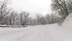 highway through a forest in winter, GoPro Stock Footage