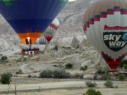 MS Shot of Hot Air Ballons Flying over Cappadocia Rocks / Goremel, Turkey Stock Footage